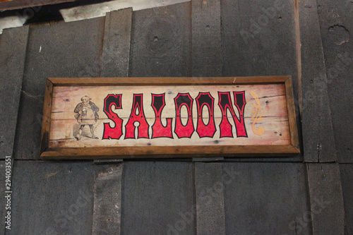 old wooden saloon sign