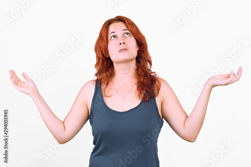 young redhead girl spreads her arms to the sky Isolated on white background © Jultud
