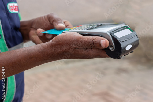 african american using a credit card machine