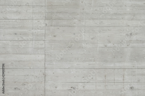 Concrete surface with wooden planks texture, with a pronounced element