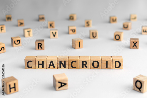 Chancroid - word from wooden blocks with letters, a venereal infection chancroid concept, random letters around, white background