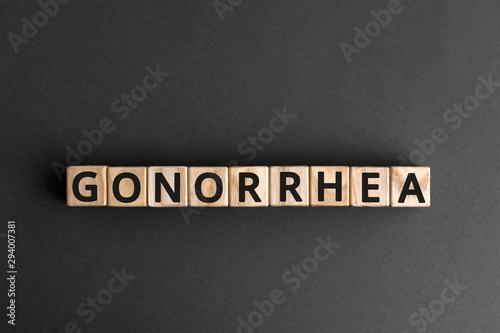 Εκτύπωση καμβά Gonorrhea - word from wooden blocks with letters, a disease of the sex organs go