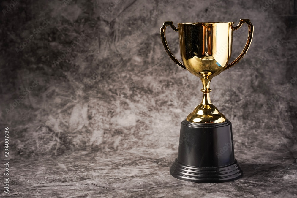 Isolated shot of Trophy replica against grey backdrop Isolated shot of Trophy replica against grey backdrop