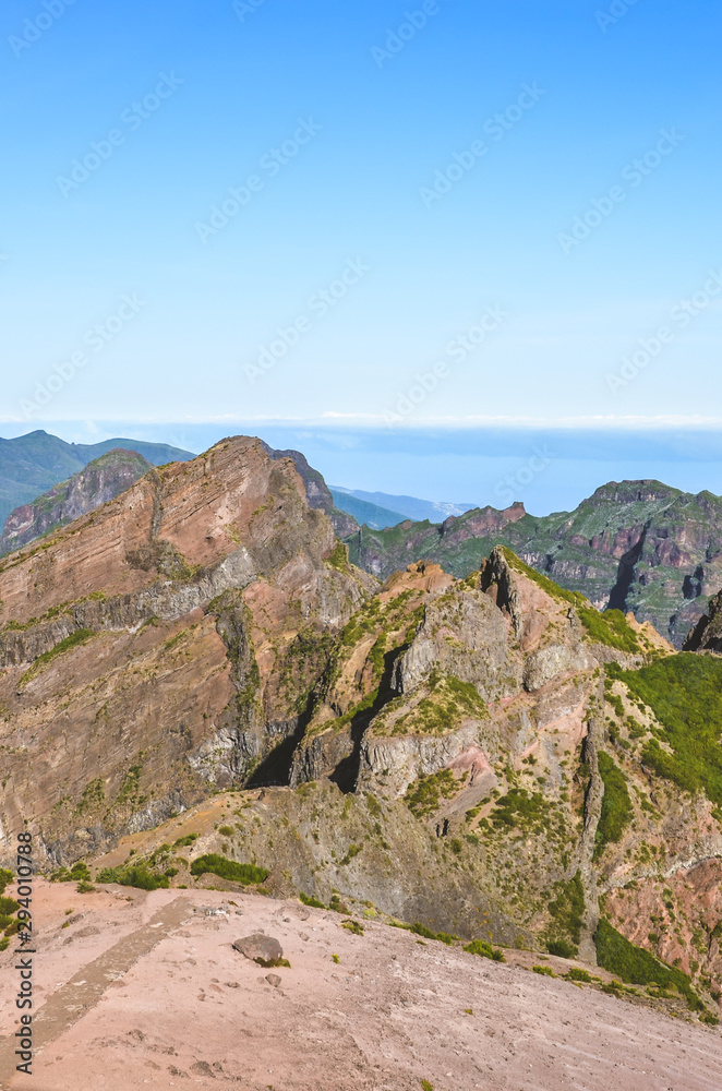 Mountain landscape with the highest mountain of Madeira island Pico Ruivo photographed from the Pico do Arieiro, the third highest peak of the Portuguese island. Hiking, trekking, mountain climbing