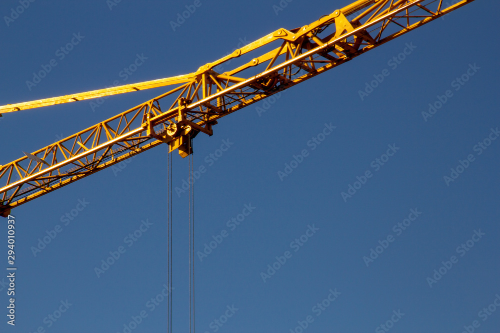 building crane under a blue sky building crane under a blue sky
