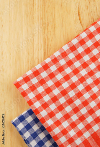 Red and blue tablecloth on wooden table