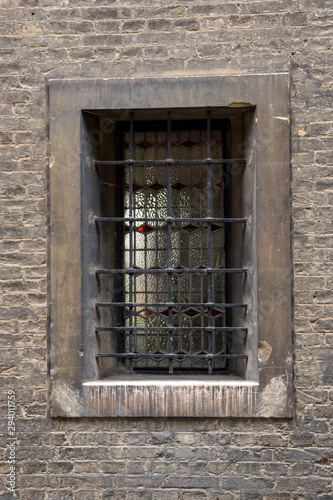 A window and bars in a central Cambridge street.