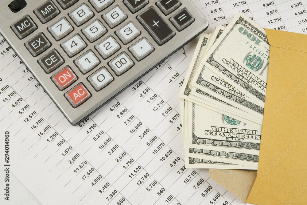 Business and profits concept with calculator, money in envelope and documents Business and profits concept with calculator, money in envelope and documents