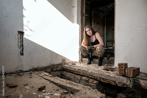 girl in military uniform on ruins