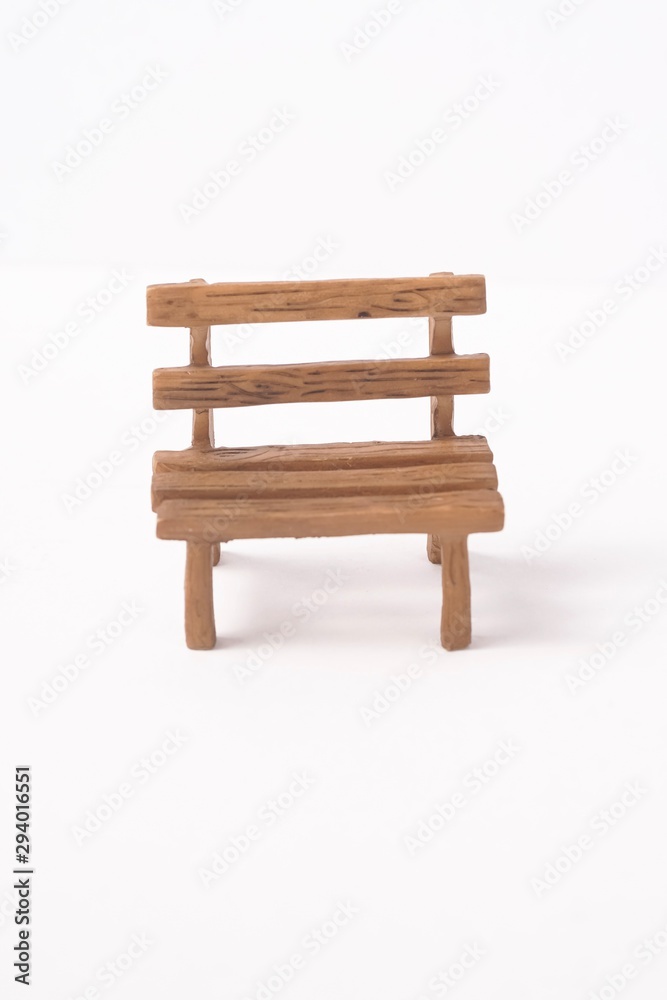 Mini wooden bench isolated against white Mini wooden bench isolated against white
