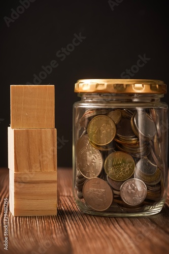 Coins in jar with copy space for text