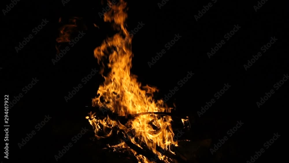 Burning fire at night, slow motion shooting. Flames of fire close-up. Burning fire at night, slow motion shooting. Flames of fire close-up.