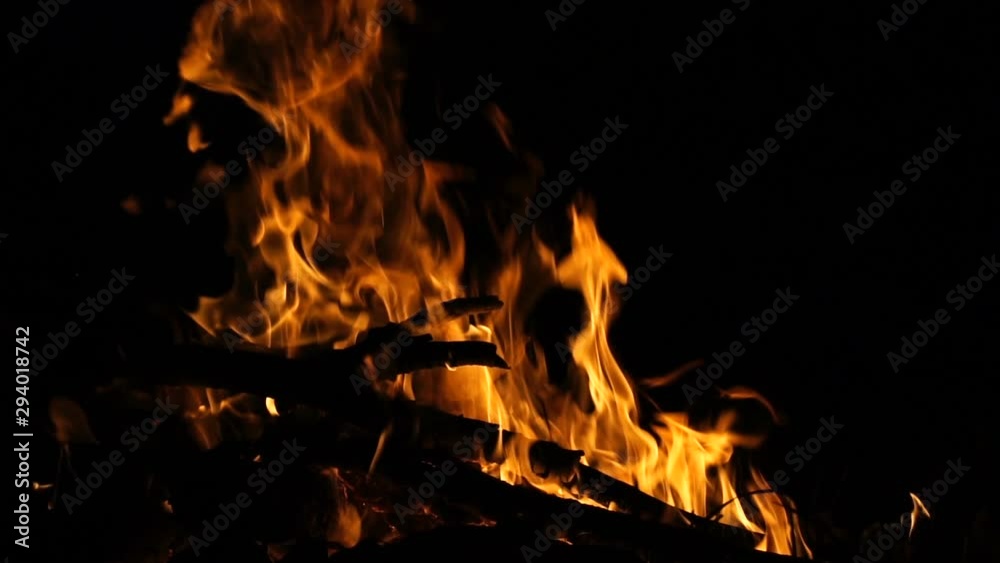 Burning fire at night, slow motion shooting. Flames of fire close-up. Burning fire at night, slow motion shooting. Flames of fire close-up.
