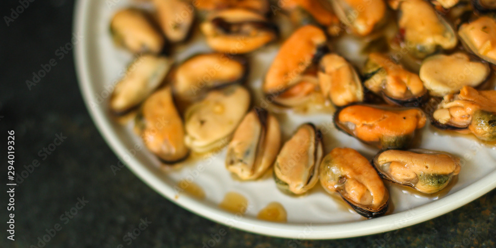 mussels in oil and spices (appetizer mollusks, pickled seafood, healthy food) menu concept. food background. copy space. Top view mussels in oil and spices (appetizer mollusks, pickled seafood, healthy food) menu concept. food background. copy space. Top view