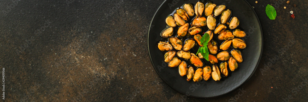 mussels in oil and spices (appetizer mollusks, pickled seafood, healthy food) menu concept. food background. copy space. Top view mussels in oil and spices (appetizer mollusks, pickled seafood, healthy food) menu concept. food background. copy space. Top view