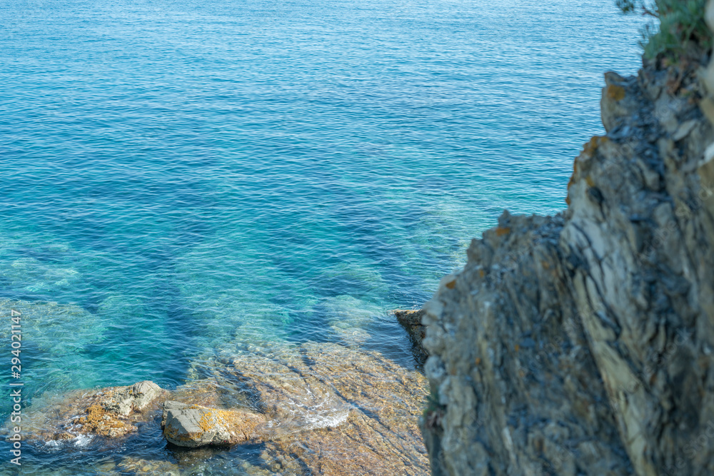 Clear Blue Sea Water in the Mediterranean Sea in Liguria, Italy Clear Blue Sea Water in the Mediterranean Sea in Liguria, Italy