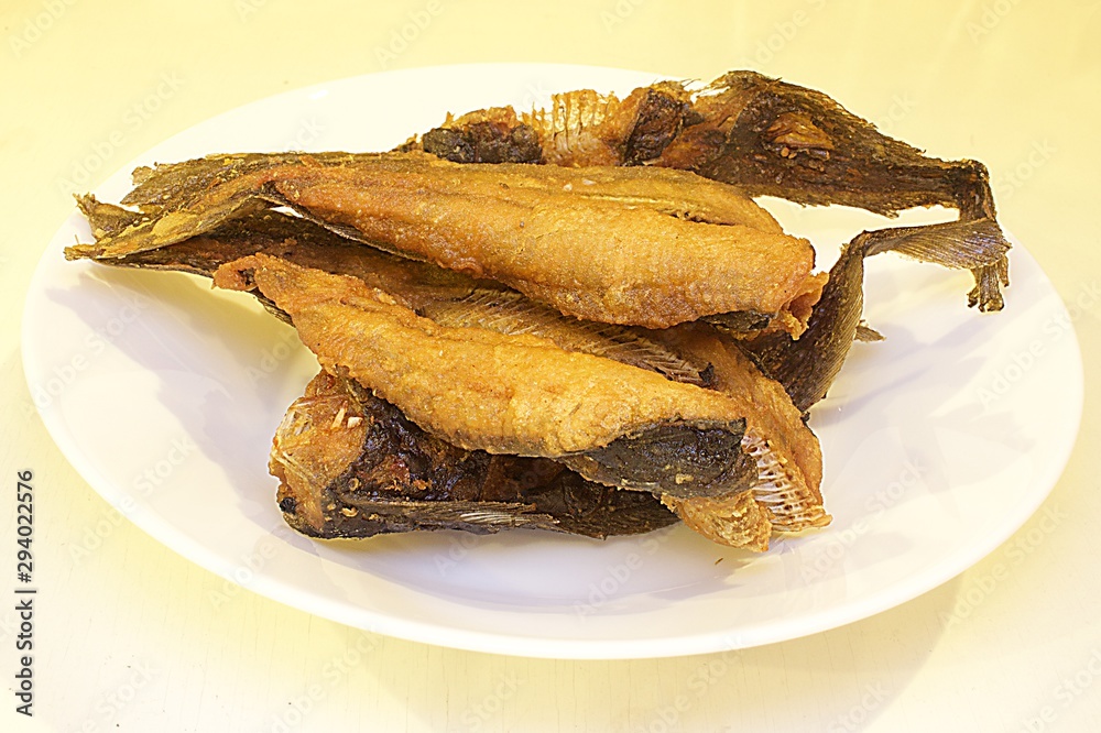 a plate of fried catfish, a typical thai food a plate of fried catfish, a typical thai food