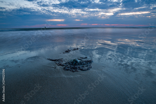 Colourful Twilight Sky over Scenic Beach in Wales, UK photo