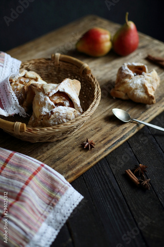 puff pastry with Apple on dark wooden background.