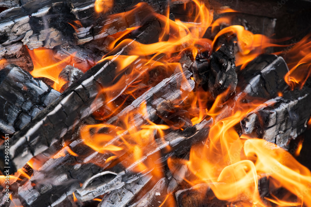 flame and burning firewood and coals close-up flame and burning firewood and coals close-up