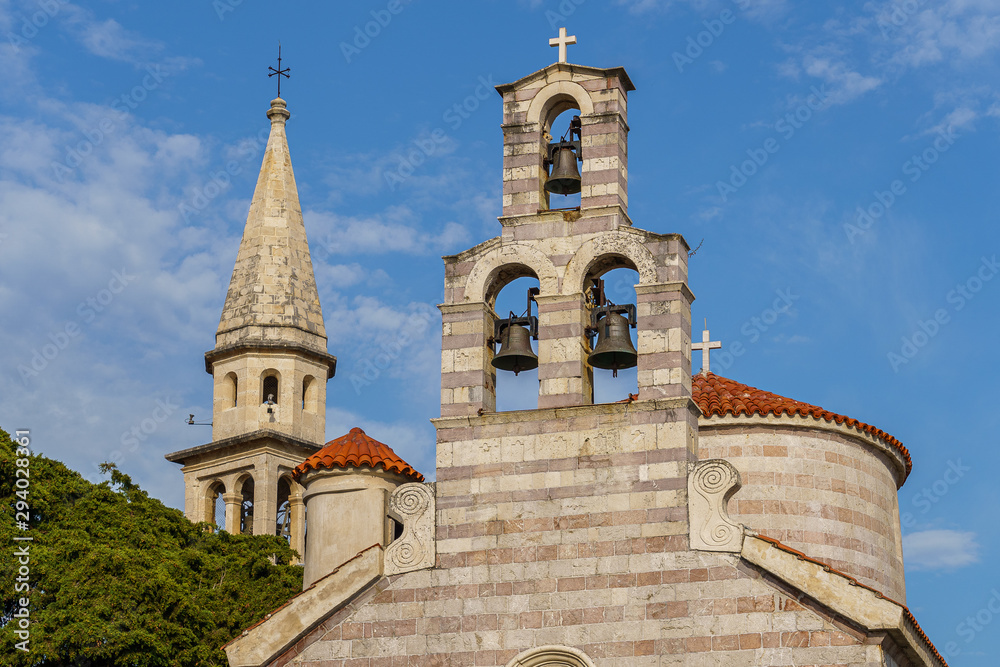 superstructure on a church with bells, electric drive for ringing, against the background of a church tower superstructure on a church with bells, electric drive for ringing, against the background of a church tower