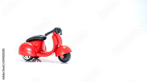 Isolated Red toy scooter on a white background