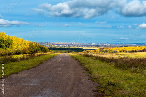 rural landscape in Chuvashia Golden autumn with a view of the city Novocheboksarsk, shot on a cloudy day photo
