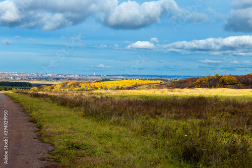 rural landscape in Chuvashia Golden autumn with a view of the city Novocheboksarsk, shot on a cloudy day photo