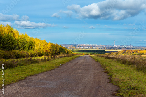rural landscape in Chuvashia Golden autumn with a view of the city Novocheboksarsk, shot on a cloudy day photo