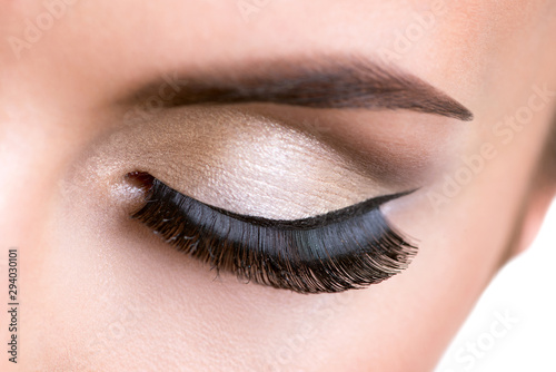 Female eye with beautiful fashion makeup.