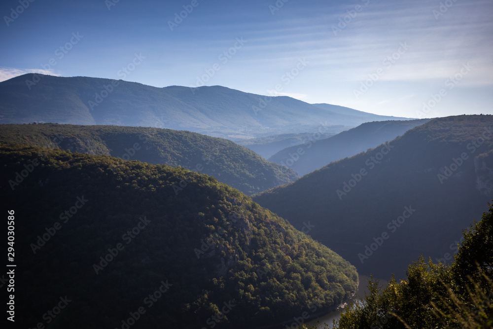 River surrounded by the hills and mountains. Vrbas river in Bosnia and Herzegovina.