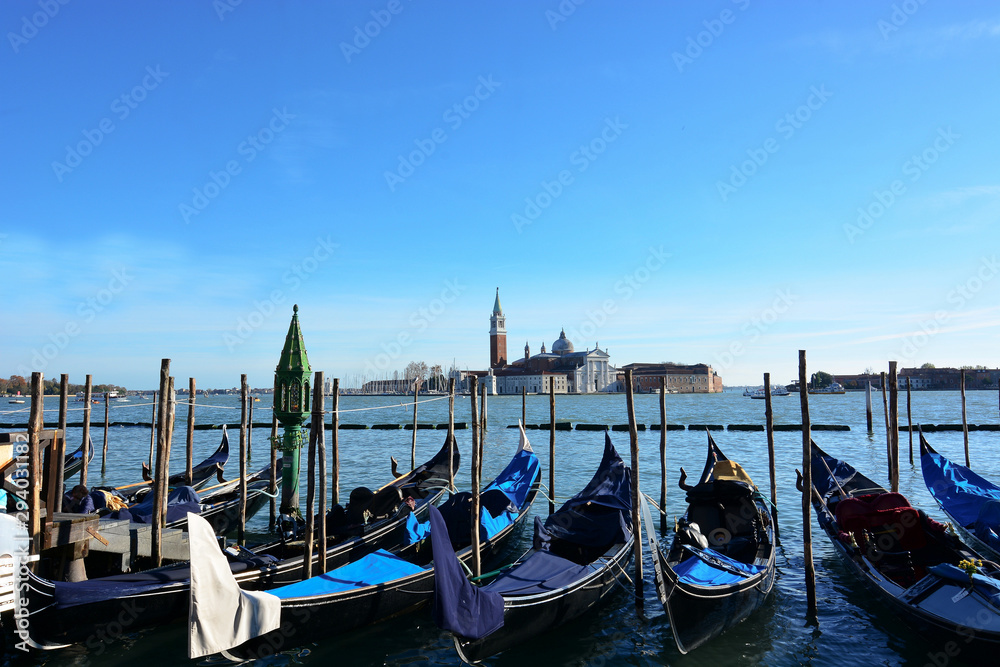 the gondolas moored in Piazza San Marco in Venice, with the island of San Giorgio in the background