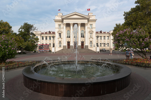 Seaside Boulevard with a fountain at the Sevastopol Palace of Children and Youth Creativity in the early summer morning, Crimea