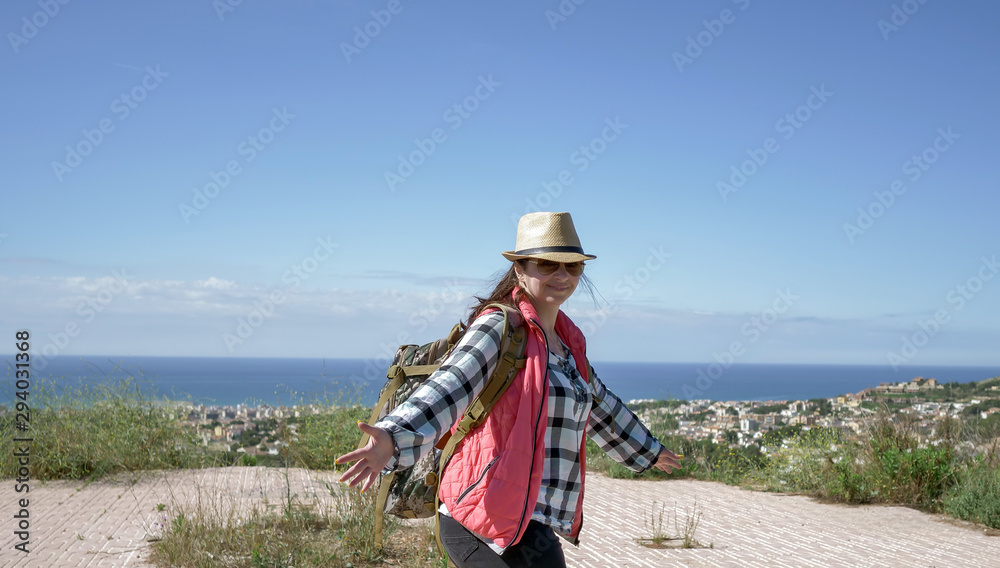 Woman tourist smiling while standing in the open. follow me