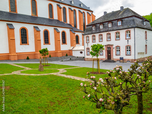 Old building next to St. Salvator Basilica, the former abbey church of the Pruem Benedictine Abbey at Pruem, Germany, parish house photo