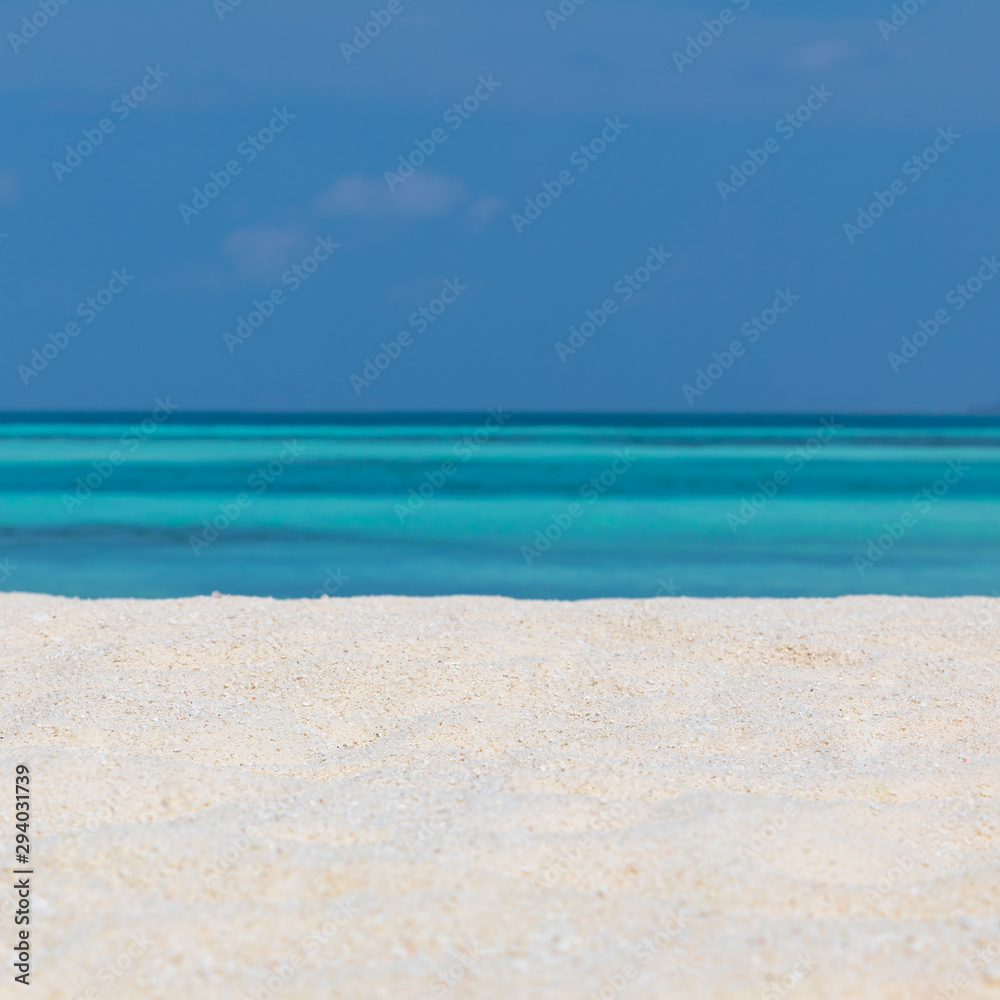 Empty tropical beach background. Horizon with sky and white sand with copy space