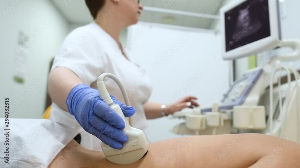 ultrasound scan. Examining back of female patient ultrasound scan. Examining back of female patient