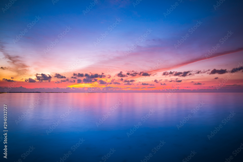 Dreamy ocean or sea with colorful sky and water reflection. Heaven concept, boost up color process