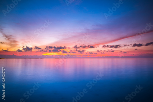 Dreamy ocean or sea with colorful sky and water reflection. Heaven concept, boost up color process © icemanphotos