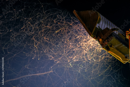 Flying insects playing in the light at night.