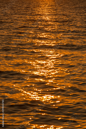 Colorful dawn over the sea, Sunset. Beautiful magic sunset over the sea. Beautiful sunset over the ocean. Sunset over water surface. vertical photo