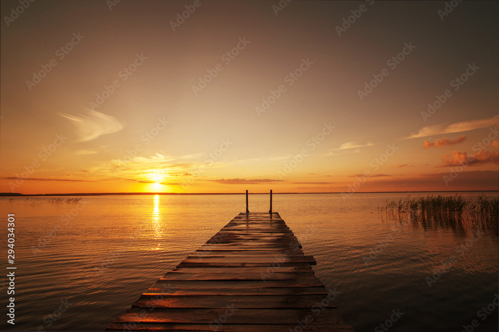 Beautiful sunset on lake in summer. Peace and relaxation in nature. Nobody