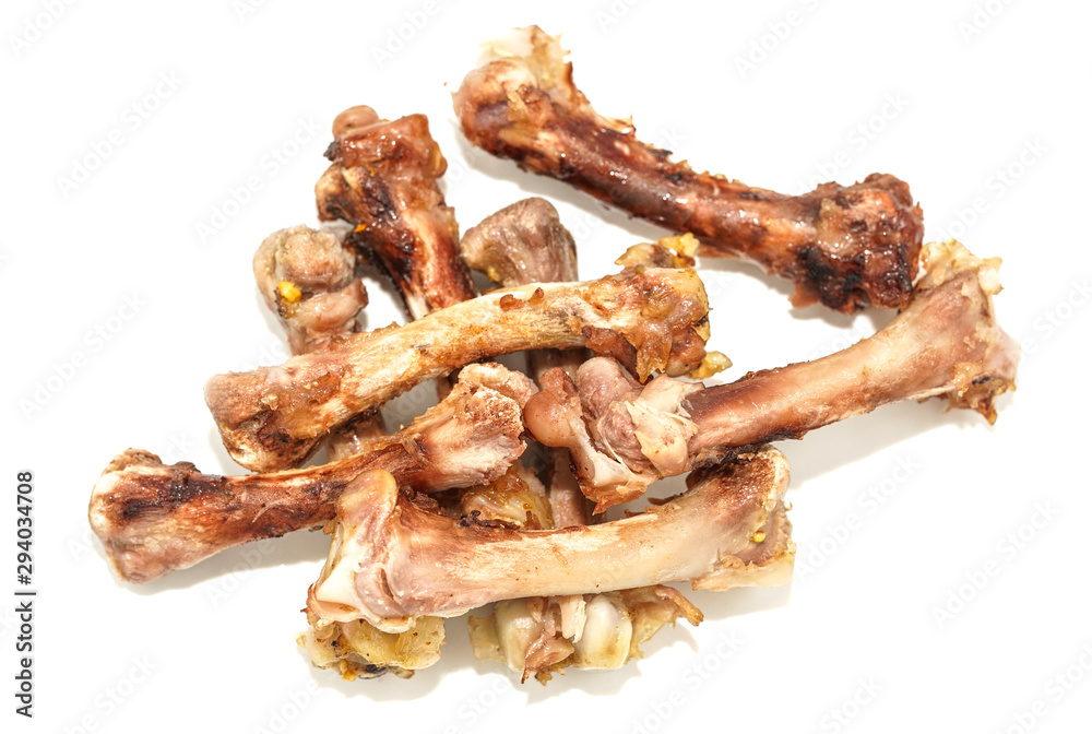 Small bones on a white background. food scraps. chicken bones Small bones on a white background. food scraps. chicken bones