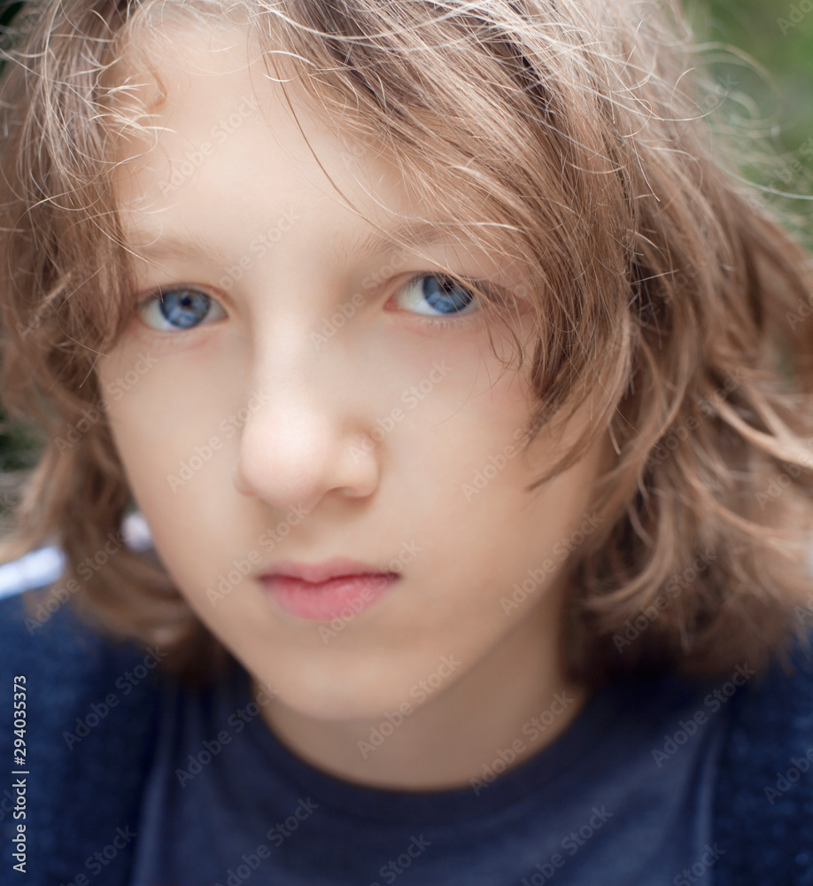 Portrait of a Boy with Brown Hair Outdoors. Portrait of a Boy with Brown Hair Outdoors.
