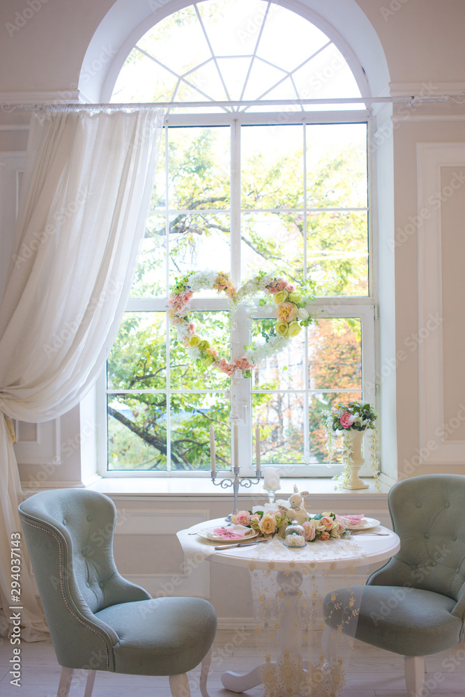 Fototapeta premium heart with flowers on the window. Romantic decor for wedding or valentine's day