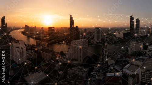 Fototapeta Naklejka Na Ścianę i Meble -  Wireless network and Connection technology concept with Abstract buildings and city background