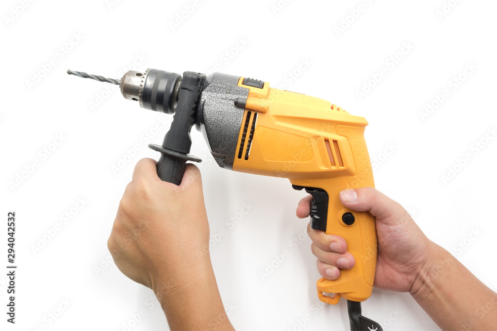 Handheld yellow household electric drill isolated on white background