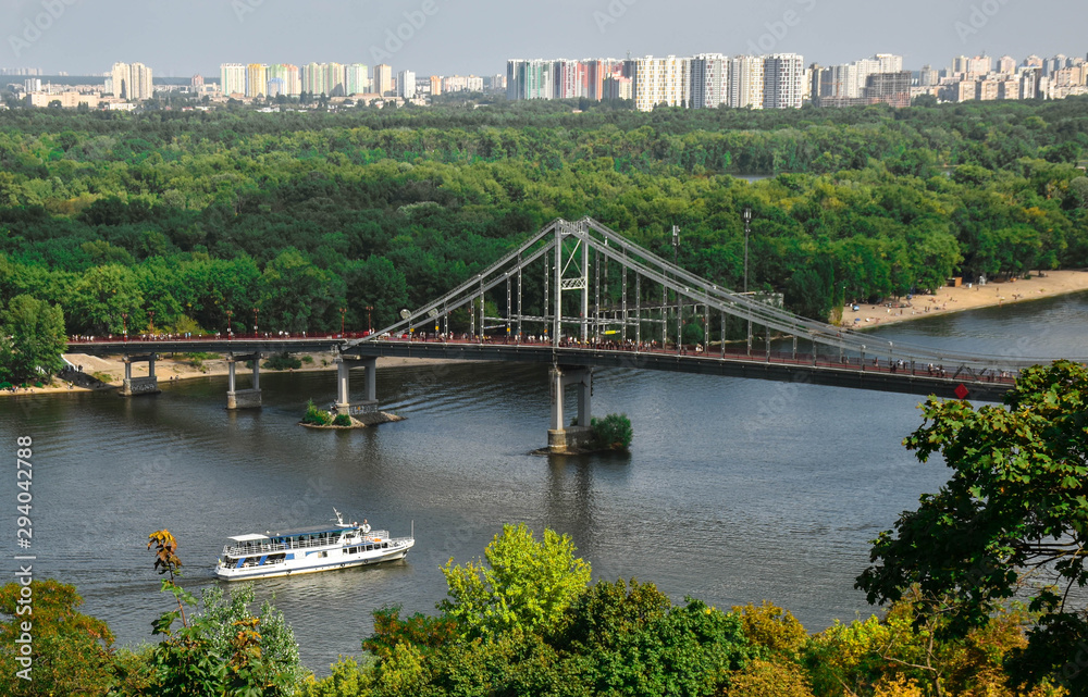 view of the pedestrian bridge over the river Dnieper in the city of Kiev