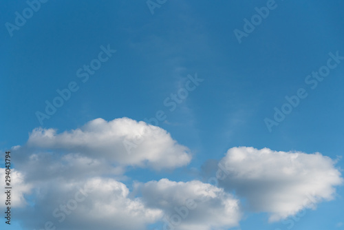 Nature background of cumulus clouds, blue sky and white clouds © knelson20