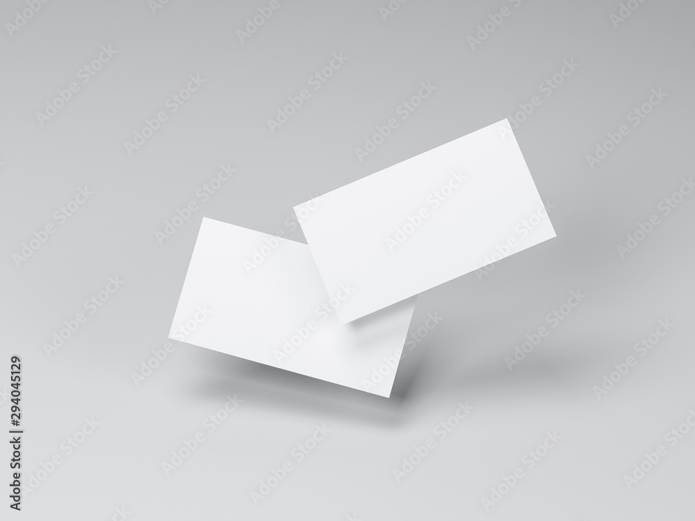 Two white Business Cards Mockup flying in gray studio Two white Business Cards Mockup flying in gray studio